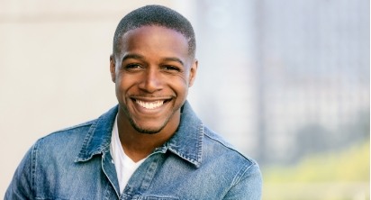 Man with healthy smile after orthodontics