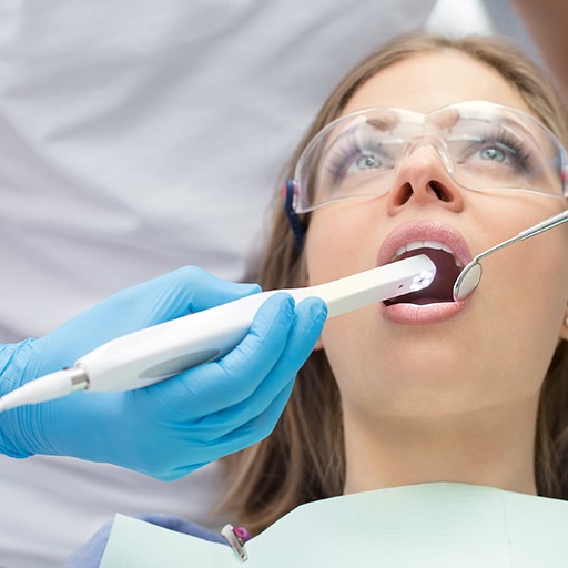 Dentist using intraoral camera to capture smile photos