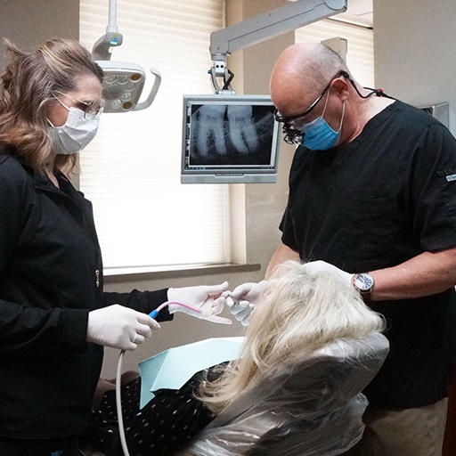 Winfield Kansas dentist David C Parsons D D S treating dental patient