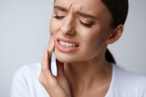 Woman in pain needing an emergency dentist in Winfield