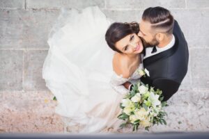 Bride and groom embrace. 